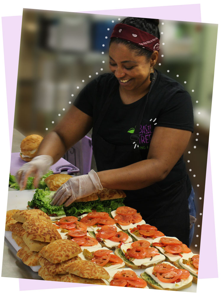 special-food Smiling cook assembling made-to-order gourmet sandwiches